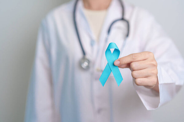 Blue November Prostate Cancer Awareness month, Doctor with Blue Ribbon in hospital for support people life and illness. Healthcare, International men, Father, Diabetes and World cancer day