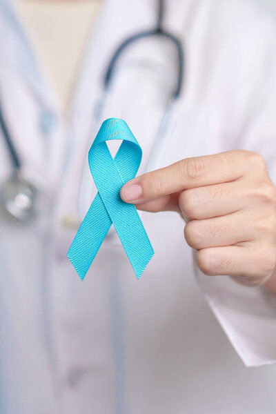 Blue November Prostate Cancer Awareness month, Doctor with Blue Ribbon in hospital for support people life and illness. Healthcare, International men, Father, Diabetes and World cancer day