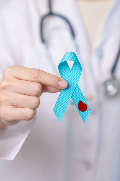 Blue November Diabetes and Prostate Cancer Awareness month, Doctor with Blue Ribbon in hospital for support people life and illness. Healthcare, International men, Father and World cancer day