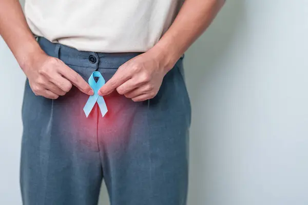 Blue November Prostate Cancer Awareness month, Man with Blue Ribbon on Prostate gland or Urinary bladder for support people life and illness. Healthcare, International men, Father and World cancer day