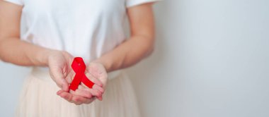 Aralık ayı için kırmızı kurdeleli kadın bağışıklık yetmezliği sendromu, çoklu miyelom kanseri farkındalığı ayı ve Ulusal Kırmızı Kurdele haftası. Sağlık ve dünya kanser günü konsepti