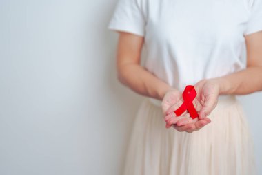 Aralık ayı için kırmızı kurdeleli kadın bağışıklık yetmezliği sendromu, çoklu miyelom kanseri farkındalığı ayı ve Ulusal Kırmızı Kurdele haftası. Sağlık ve dünya kanser günü konsepti