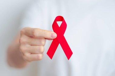 Aralık ayı için kırmızı kurdeleli kadın bağışıklık yetmezliği sendromu, çoklu miyelom kanseri farkındalığı ayı ve Ulusal Kırmızı Kurdele haftası. Sağlık ve dünya kanser günü konsepti