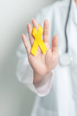 Yellow September, Suicide prevention day, Childhood, Sarcoma, bone and bladder cancer Awareness month, Yellow Ribbon for supporting people life and illness. Healthcare and World cancer day concept