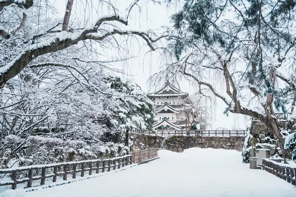 stock image White Hirosaki Castle or Takaoka Castle with snow in winter, hirayama style Japanese castle located in Hirosaki city, Aomori Prefecture, Tohoku, Japan. Landmark for tourist attraction. Japan travel