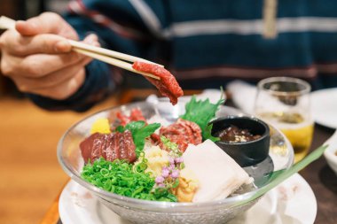 horse meat pieces sashimi or Japanese Basashi. Baniku includes lean meat, superb marbling, mane and liver. Premium meat and famous food in Matsumoto city, Nagano Prefecture, Japan clipart