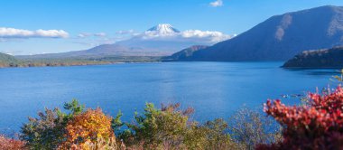 Mount Fuji at Lake Motosu in Autumn season. Mt Fujisan in Fujikawaguchiko, Yamanashi, Japan. Landmark for tourists attraction. Japan Travel, Destination, Vacation and Mount Fuji Day concept clipart