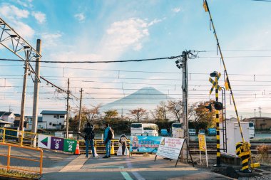 Kawaguchiko Station with Mount Fuji behind, is a railway station on the Fujikyuko Line in Fujikawaguchiko, Yamanashi, Japan, operated by Fuji Kyuko (Fujikyu). Yamanashi, Japan, 15 November 2023 clipart