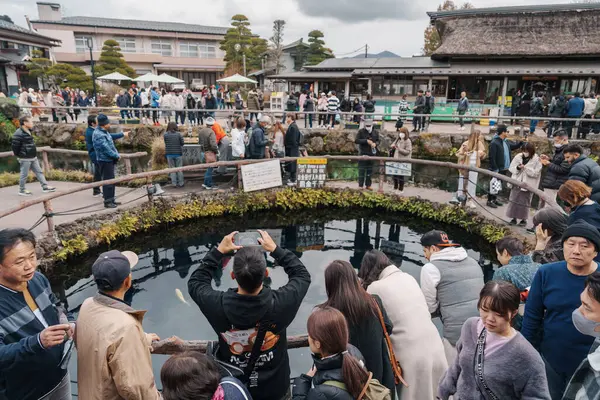 stock image Tourists sightseeing Oshino Hakkai village. Yamanashi, Japan, 15 November 2023