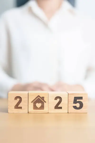 stock image Happy New Year 2025 with Home and Heart block. Property investment, House Mortgage, Real Estate tax, homeless, donation, Financial and happy family concepts