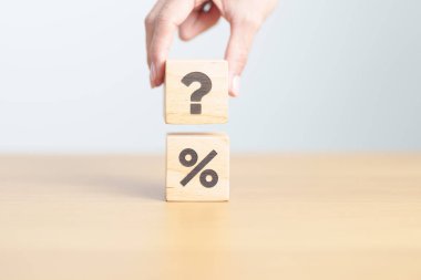 wood block of Question mark and Percentage. Interest rate, GDP, stocks market, financial, deflation and Inflation, ranking, mortgage, debt, Loan and Economic Recession clipart