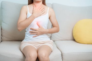 Gastroesophageal Reflux Disease or GERD, Acid reflux disease, Gastro Oesophageal or GORD and Dyspepsia concept. woman having Stomach ache and Esophageal pain due to Digestion system problem clipart