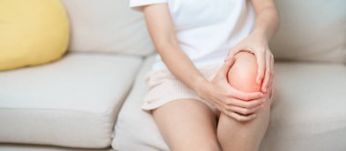 woman having knee ache and muscle pain due to Runners Knee or Patellofemoral Pain Syndrome, osteoarthritis, arthritis, rheumatism and Patellar Tendinitis. medical concept