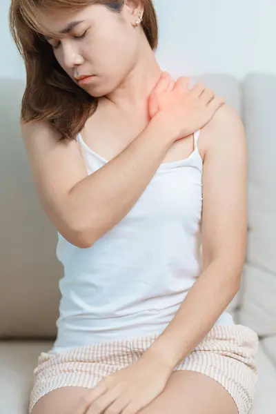 stock image Woman having Shoulder and Neck pain at home. Muscle painful due to Myofascial pain syndrome and Fibromyalgia, rheumatism, Scapular pain, Cervical Spine. ergonomic concept