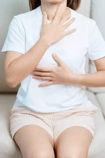 stock image Gastroesophageal Reflux Disease or GERD, Acid reflux disease, Gastro Oesophageal or GORD and Dyspepsia concept. woman having Stomach ache and Esophageal pain due to Digestion system problem