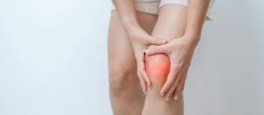 woman having knee ache and muscle pain due to Runners Knee or Patellofemoral Pain Syndrome, osteoarthritis, arthritis, rheumatism and Patellar Tendinitis. medical concept