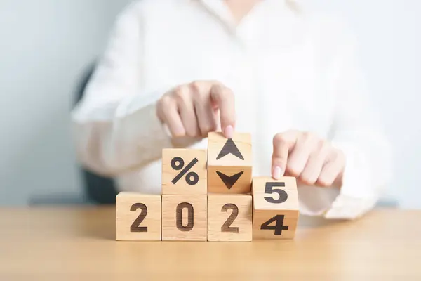 stock image 2024 to 2025 New year with percentage change to UP and Down arrow. Interest rate, GDP, stocks market, financial, deflation and Inflation, mortgage, debt, Loan and Economic Recession