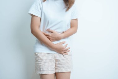 Woman having Stomach pain. Ovarian and Cervical cancer, Cervix disorder, Endometriosis, Hysterectomy, Uterine fibroids, Reproductive system, menstruation, diarrhea and Pregnancy concept