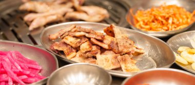 meat pork grilled on stove serve in restaurant. Korean food and BBQ traditional style clipart