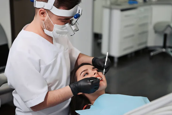 Overview of dental caries prevention. Girl at the dentist\'s chair during a dental procedure. Healthy Smile.
