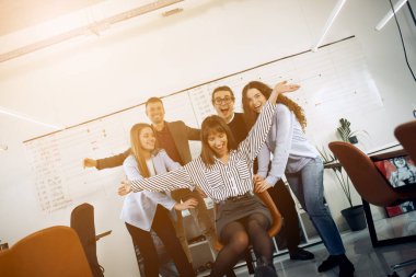 A group of happy people are having a fun after hard week of work.