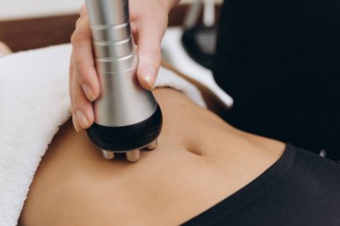 Cosmetologist. Lymphatic drainage massage LPG apparatus process. Woman getting massage in a beauty SPA salon. LPG, and body contouring treatment in clinic