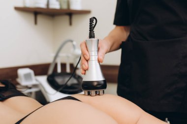 Cosmetologist. Lymphatic drainage massage LPG apparatus process. Woman getting massage in a beauty SPA salon. LPG, and body contouring treatment in clinic