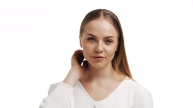 Beauty skin. Head and shoulders of blond woman model, touching glowing, hydrated facial skin, apply toner, skin cream or lotion for healthy look, after shower portrait, white background.