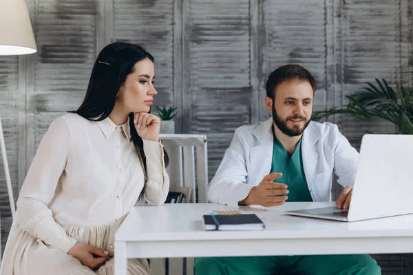 stock image Gynecology consultation. Pregnant woman with her doctor in clinic.