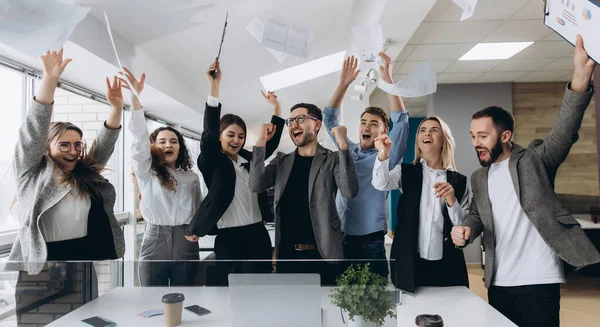 stock image success and winning concept - happy business team celebrating victory in office