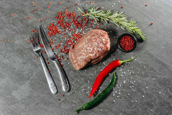 Large Juicy Ribeye Steak Red Pepper Sprinkles Black Saucer Rosemary — Stock Photo, Image