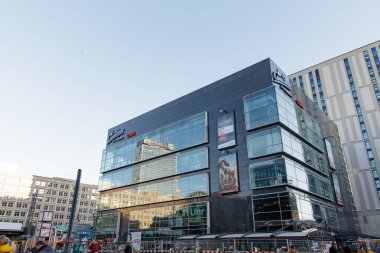 Berlin, Germany - December 15, 2019: Modern building with glass facade reflecting the cityscape during the christmas season