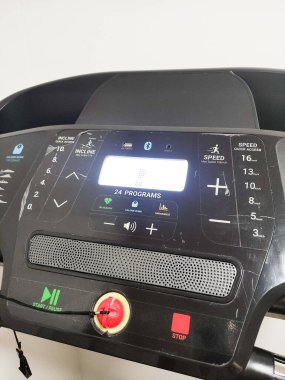 Prague, Czech Republic - September 08, 2022: Treadmill control panel multiple settings, buttons, and digital display for fitness enthusiasts and athletes, designed for effective workouts and training