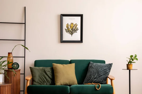 stock image Elegant living room with mock up poster frame, bottle green sofa, wooden stand, side table, decoration, plants, elegant accessories and plaid. Minimalist home decor. Template.