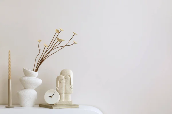Minimalist composition of elegant and outstanding space with copy space, vase with dried flowers and personal accessories. Home decor. Template.