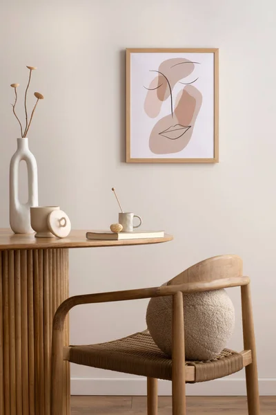 Minimalist composition of dining interior with round wooden table, design chair, mock. up poster frame, vase with dried flowers, decoration and personal accessories. Stylish home decor. Template.