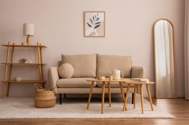 Creative composition of living room interior with mock up poster frame, classic design sofa, wooden round coffee table, mirror, basket, round pillow, bright carpet and personal accessories. Home decor. Template.