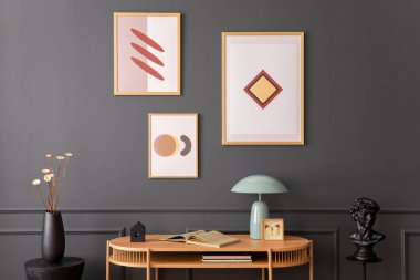 Minimalist composition of living room interior with mock up poster frame, wooden desk, books, lamp, sculpture, black stand, vase with dried flowers and personal accessories. Home decor. Template.