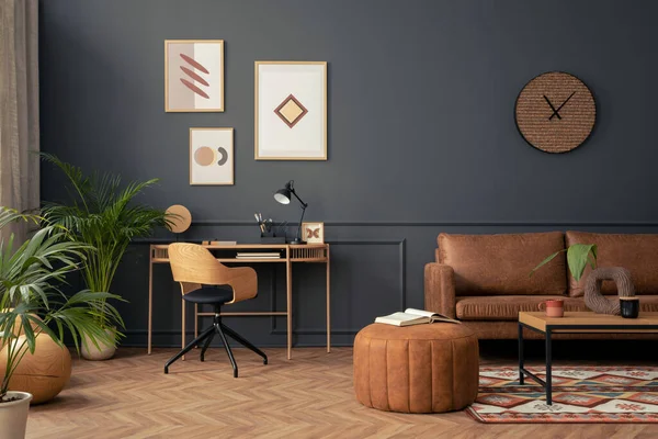 Creative composition of living room interior with mock up poster frame,  brown sofa, wooden desk, stylish armchair, pouf , coffee table, rug and personal accessories. Home decor. Template.