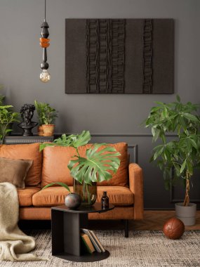 Creative composition of living room interior with mock up poster frame, brown sofa, plants in flowerpots, black coffee table, pillows, plaid, carpet and personal accessories. Home decor. Template.