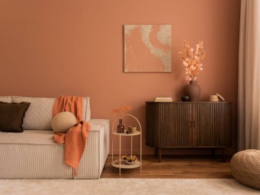 Creative composition of living room interior with mock up poster frame, wooden sideboard, modular beige sofa, brown pouf, plaid, pillows, rug, pink wall and personal accessories. Home decor. Template.