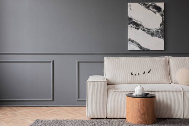 Minimalist composition of living room interior with mock up poster frame,  copy space, modular sofa, wooden coffee table, carpet, dark wall with stucco and personal accessories. Home decor. Template.