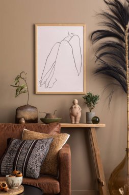 Warm and cozy composition of living room interior with mock up poster frame, wooden bench, brown sofa, vase with leaves, sculpture, patterned pillows and personal accessories. Home decor. Template. clipart