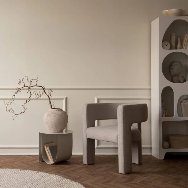 stock image Interior design of living room interior with copy space, modern armchair, vase with branch, gray coffee table, round pillow, beige rug, white rack and personal accessories. Home decor. Template.