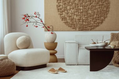 Aesthetic composition of living room interior with mock up poster frame, modular sofa, oval shapes armchair, stylish coffee table, vase with rowan and personal accessories. Home decor. Template.