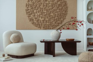 Aesthetic composition of japandi living room interior with mock up poster frame, modern black coffee table, vase with rowan, rounded shapes armchair and personal accessories. Home decor. Template.