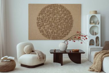 Aesthetic composition of japandi living room interior with mock up poster frame, modern black coffee table, vase with rowan, rounded shapes armchair and personal accessories. Home decor. Template.