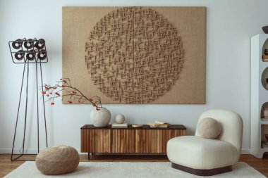 Interior design of living room interior with mock up poster frame, white armchair, wooden sideboard, sculpture, rug, vase with rowan, black modern lamp and personal accessories. Home decor. Template.