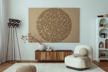 Interior design of living room interior with mock up poster frame, white armchair, wooden sideboard, sculpture, rug, vase with rowan, black modern lamp and personal accessories. Home decor. Template.