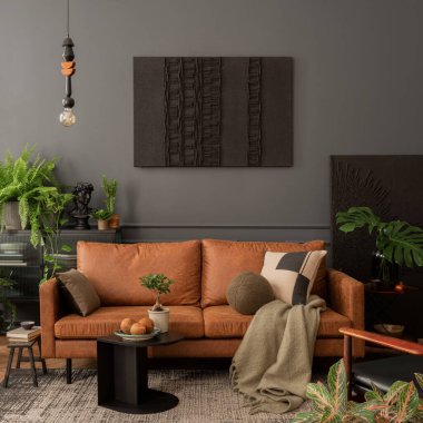 Aesthetic interior of living room with mock up poster frame, brown sofa, plants, black coffee table, bowl with coconuts, green plaid, pillows, carpet and personal accessories. Home decor. Template. 